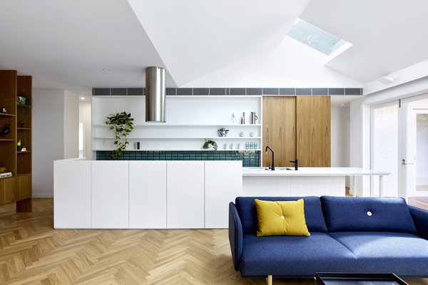 When they took on the renovation of one such home for a family of five, they reconfigured the internal layout to bring more natural light deep into the common living areas, and better connect them to the surrounding landscape.