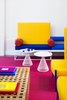 Modern home with Living Room, End Tables, Coffee Tables, Bench, and Carpet Floor. Bright, bold colors infuse the lobby. Photo 9 of Shoreline Hotel Waikiki