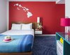 Modern home with Bedroom, Table Lighting, Bed, Wall Lighting, Carpet Floor, and Night Stands. The custom drapery and blankets were designed by BHDM. The colorful, customized furniture are from BluDot and Missana. Photo 14 of Shoreline Hotel Waikiki