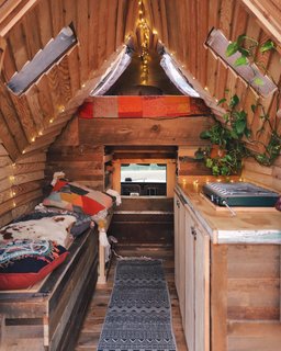Made mostly with salvaged wood, its aerodynamic roof and sides serve as wind breaks. 