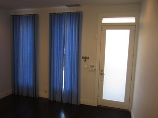 Before: the living room and front door.