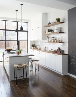 Kitchen stools from One Forty Three; steel and glass doors by A&S Steel Windows.