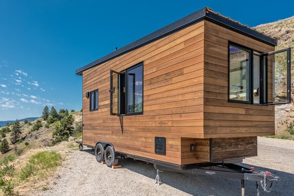 The exterior is clad in a mixture of stained cedar and shou sugi ban siding.

