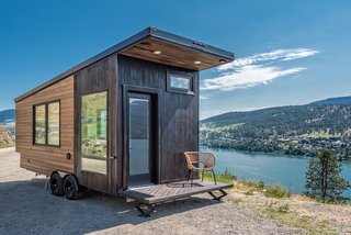 Designed and built by Oliver Stankiewicz and Cera Bollo—the husband-and-wife team of Canadian tiny home builder Summit Tiny Homes—this 22-foot-long, 175-square-foot contemporary tiny home called The Wanderer was built with mobility and adventure in mind. Constructed with an aerodynamic roofline, the home also features a compact, fold-down deck that's convenient for traveling. The stylish exterior is clad in a mixture of stained cedar and shou sugi ban siding. This model is available for $53,780. 