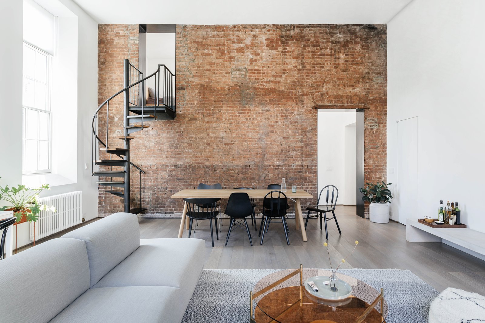 A Small Manhattan Home Gains E With Two Cozy Lofts Dwell Dining Room Table Chair And Light Hardwood Floor After A Strategic Renovation