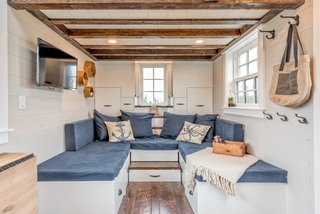 In the living area is a U-shaped, multi-use couch that can be easily turned into a guest bed when needed. 