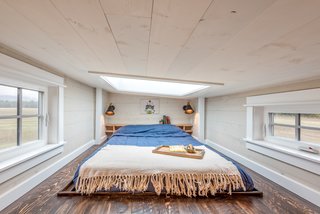 At night, the owners can look up at the stars through the skylight in the lofted bedroom area.