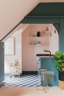 A small kitchen is located in the attic, and has been largely decorated with IKEA furnishings.