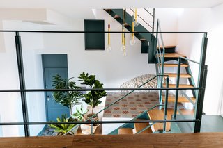 The home's oak parquet flooring strikes contrast with traditional Sicilian patterned tiles. 