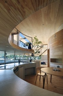 The simple, clean-lined kitchen and dining area is the heart of the home.