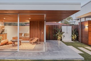 The studio's program is divided between a pergola, an outdoor refuge, and an entirely self-contained separate granny flat.
