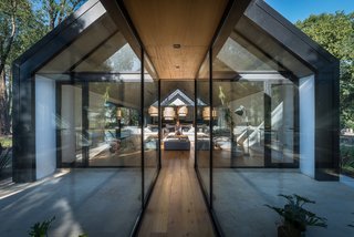 The wooden floors inside the house echo the trees outside.