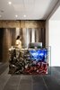 BURSA's reception desk is composed of scrunched-up metal sheets set behind a glass panel. Photo 3 of BURSA Hotel modern home