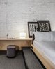 Modern home with Bedroom, Table Lighting, and Bed. A Muuto “Cosy In White” table lamp. Photo 14 of BURSA Hotel