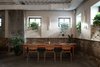 Modern home with Dining Room, Chair, Table, and Concrete Floor. A corner table at Beliy Shum restaurant. Photo 9 of BURSA Hotel