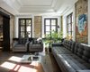 Modern home with Living Room, Sofa, Floor Lighting, End Tables, and Chair. Founded by 24-year-old Russian entrepreneur Vasily Grogol, BURSA is a new hotel that includes a non-commercial art gallery, 33 contemporary guest rooms, a ground-floor restaurant, and a top-floor bar that opens onto a rooftop terrace. The 20,451-square-foot hotel complex was designed by local practice balbek bureau. "The idea was to link two old buildings with a modern block, where appreciation of history and tradition will co-exist with modern art, design, and innovation," says balbek bureau’s founder, Slava Balbek who worked with fellow architect Andrii Berezynskyi on the redesign. Photo 2 of BURSA Hotel
