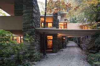 Fallingwater, view of entry (center) with trellis beams extending across drive.