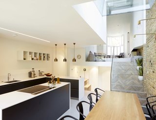 The living lounge visually connects to the dining area and kitchen.
