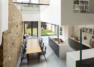 The renovation retained the old brick wall in the dining area and kitchen.