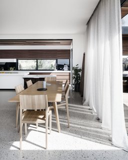 A Fameg Table ST-1403 from Remodern provides a minimalist dining setting.