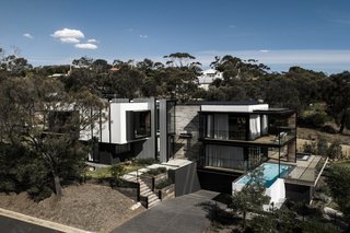 The sustainable, energy-efficient house is equipped with water tanks, solar panels, and has solar-heated water for the pool and domestic use.