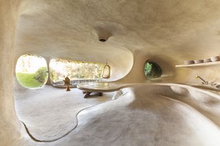 The smoothly sculpted interior flows organically from room to room.