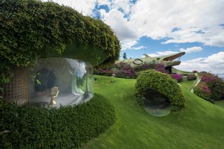 The living room features a hand-shaped chair by Mexican artist Pedro Friedeberg, and a Bubble chair by Eero Aarnio.