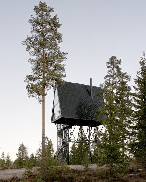 Designed by Espen Surnevik, the PAN Treetop Cabins consist of two A-frame structures elevated into the treetops of a Norwegian forest.  