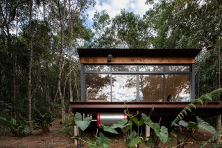 The volume sits on a prefabricated fiberglass box base over concrete columns.