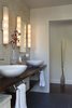 Modern home with Bath Room, Wood Counter, Porcelain Tile Floor, Mosaic Tile Wall, Wall Lighting, and Vessel Sink. Master Bath with live edge counter Photo 8 of Healdsburg Makeover