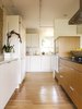 Modern home with Kitchen, Engineered Quartz Counter, White Cabinet, Refrigerator, Wall Oven, Wood Cabinet, Medium Hardwood Floor, Ceiling Lighting, Dishwasher, and Drop In Sink. Work aisle Photo 3 of Sonoma Modern Kitchen