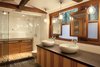 Modern home with Bath Room, Engineered Quartz Counter, Vessel Sink, Slate Floor, Enclosed Shower, Ceiling Lighting, and Subway Tile Wall. The Master Bathroom combines mirrors and an opaque film with the existing windows for light and privacy Photo 4 of Creekside Cabin