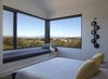 Modern home with Front Yard, Wood Patio, Porch, Deck, Large Patio, Porch, Deck, Gardens, Metal Patio, Porch, Deck, Wire Fences, Wall, Closet Storage Type, Under Stairs Storage Type, Wood Tread, Metal Railing, Bench, Pendant Lighting, Medium Hardwood Floor, Wood Burning Fireplace, Picture Window Type, Wood, and Windows. View from the Master corner window Photo 10 of Modern Vineyard Farmhouse