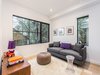 The family room, adjacent to the kitchen, features views on a private garden. Photo 5 of Manor Road house modern home