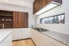 A long window above the countertop provides a nice view to the outside world while cooking. Photo 7 of Manor Road house modern home
