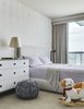 Modern home with Kids Room, Bedroom Room Type, Night Stands, Bed, Carpet Floor, Dresser, Pre-Teen Age, Girl Gender, and Rockers. Sophisticated Play Photo 7 of Arden Mission Bay Contemporary Condo