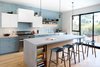Modern home with Kitchen, Range, Range Hood, White Cabinet, Colorful Cabinet, Light Hardwood Floor, Ceramic Tile Backsplashe, and Subway Tile Backsplashe. Kitchen Photo 7 of 27th Street - Noe Valley