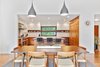 Modern home with Dining Room, Table, Lamps, Chair, Pendant Lighting, Medium Hardwood Floor, and Ceiling Lighting. Dining room Photo 8 of Portola Valley
