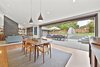 Modern home with Living Room, Sofa, Pendant Lighting, Chair, Standard Layout Fireplace, Ceiling Lighting, and Medium Hardwood Floor. Dining room Photo 12 of Portola Valley