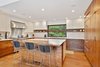 Modern home with Kitchen, Engineered Quartz Counter, Medium Hardwood Floor, Ceiling Lighting, Stone Slab Backsplashe, Wood Cabinet, Refrigerator, Range, Range Hood, and Undermount Sink. Kitchen Photo 13 of Portola Valley