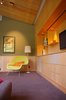 Modern home with Living Room, Media Cabinet, Chair, Track Lighting, Recessed Lighting, Accent Lighting, and Carpet Floor. Close up of media cabinet with hidden speakers and drop down screen Photo 6 of Alamo