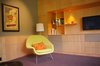 Modern home with Living Room, Chair, Media Cabinet, Shelves, Storage, Accent Lighting, and Recessed Lighting. Doug fir wall paneling and wainscot Photo 7 of Alamo