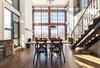 The 18' ceilings in the dining room and the living room and all the light pouring from the huge windows bring a real feeling of grandeur. Photo of La Maison Hatley modern home