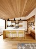 Swell lights by Pablo hang above Hot Mesh stools from Blu Dot. The millwork is by J. Spix Fine Cabinets. Photo 3 of A Renovated Tiny Victorian modern home