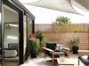 Modern home with Outdoor, Small Patio, Porch, Deck, Wood Fences, Wall, Decking Patio, Porch, Deck, and Raised Planters. Outdoor space off master bedroom Photo 9 of Laidley Cottage