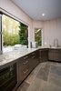 The stainless steel cabinets and appliances in this outdoor kitchen are customized for outdoor use. Because it is an outdoor kitchen, all plumbing is designed to be drained and winterized. Photo 7 of Outdoor Kitchen and Patio modern home