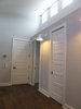 Modern home with Hallway and Medium Hardwood Floor. Window placement along the ceiling line provide both natural light and privacy for this downtown residence. Photo 5 of Commercial Garage Converted