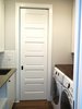 Modern home with Laundry Room, Side-by-Side, Engineered Quartz Counter, and White Cabinet. A pocket door was installed to make efficient use of space for the small laundry room. Photo 6 of Commercial Garage Converted