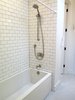 Modern home with Bath Room, Porcelain Tile Floor, Alcove Tub, Open Shower, Subway Tile Wall, Ceiling Lighting, and Recessed Lighting. A second full bath combines white subway and penny tile for a retro look. Photo 10 of Commercial Garage Converted