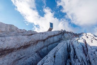 Designed by OFIS Arhitekti, this cabin is located in Slovenia's Kanin Mountains. 